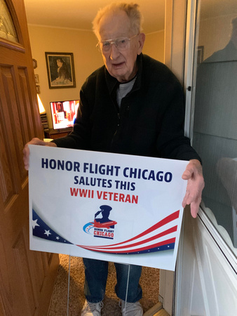 122020 Harry Hengesh - Honor Flight photo of veteran and sign - second picture (1)